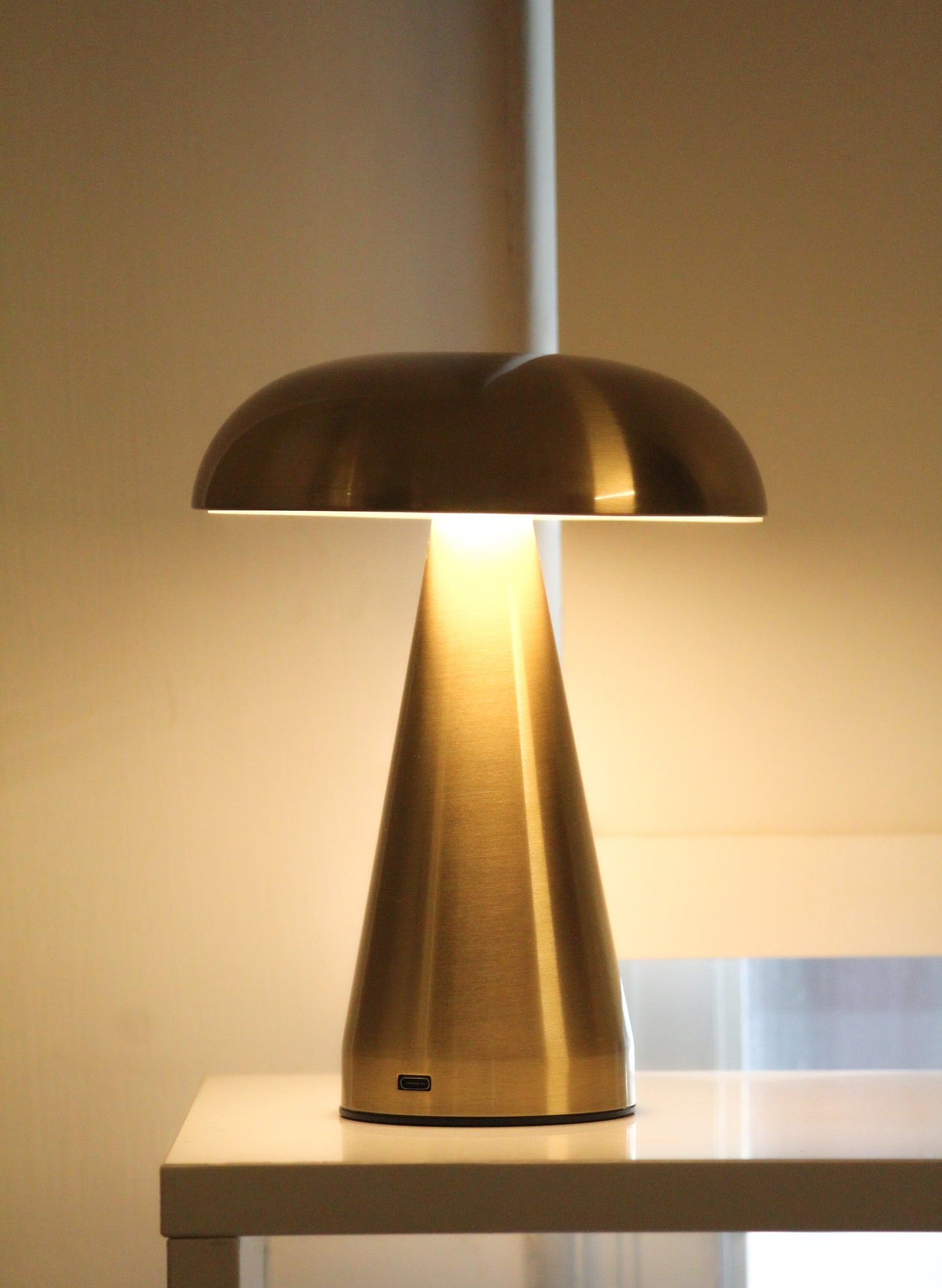 Garnish Mushroom metal lamp, a iconic gold-finished task light for luxury home office decor.
