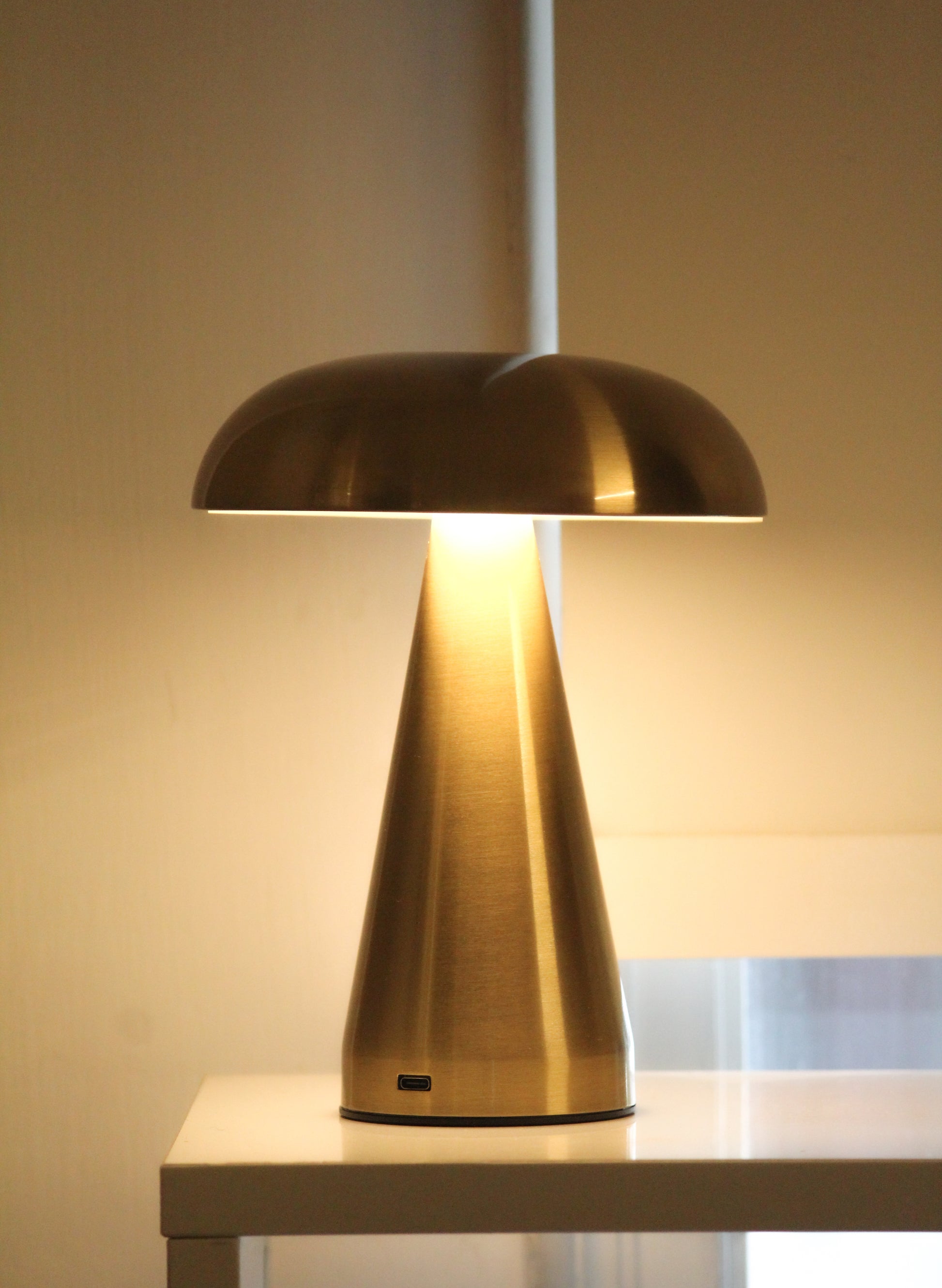 Garnish Mushroom metal lamp, a iconic gold-finished task light for luxury home office decor.