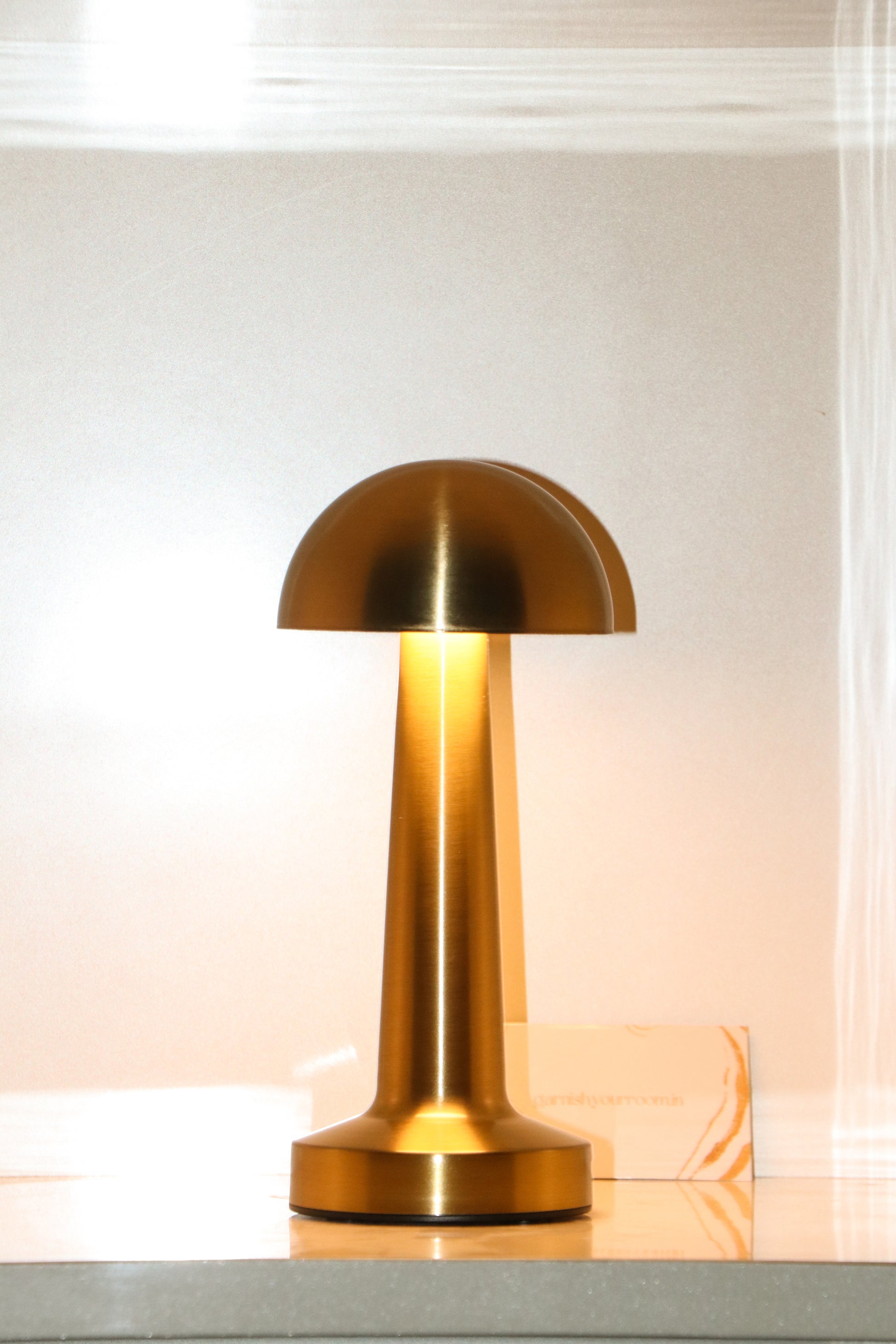 Portrait shot of the Button Mushroom lamp's compact and playful proportions.